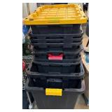 Stack of Nine Black and Yellow Storage Totes