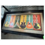 Framed Artwork Featuring Colorful Guitars