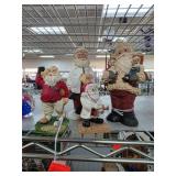 Four Santa Claus Figurines