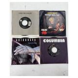 Four Vintage 7-Inch Vinyl Records