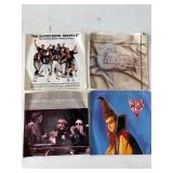 Four Vintage 45 RPM Vinyl Records