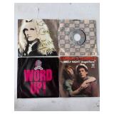 Four 45 RPM Vinyl Records
