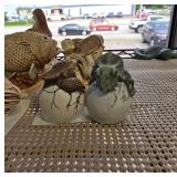 Dinosaur Figurines Emerging from Cracked Eggs