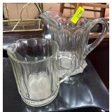 Two Clear Glass Pitchers