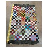 Patchwork Quilted Textile with Varied Patterns