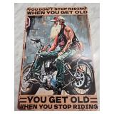 Metal Sign Featuring Biker Illustration