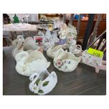 Porcelain Figurines Featuring Swans and Floral Des