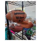 Three Wilson Footballs