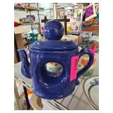 Blue Ceramic Teapot with Unique Cutout Design