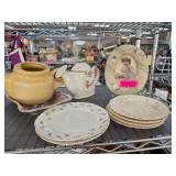 Ceramic Teapots, Plates, and Oval Frame Decor