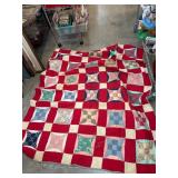Patchwork Quilt with Red and Patterned Squares