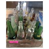 Vintage Glass Soda Bottles in Wooden Crate