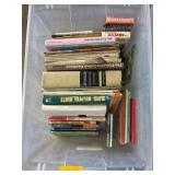 Plastic Bin with Mixed Books and DVDs