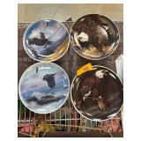 Four Decorative Plates Featuring Eagles