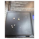 Loose Diamonds and Gold Jewelry Pieces