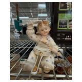 Porcelain Figurine of Child Playing with Spoon