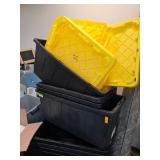 Stacked Black Storage Bins With Yellow Lids