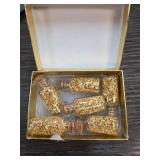 Gold Flake-Filled Glass Bottles