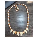 Beaded Necklace With Tooth-Shaped Pendants