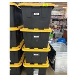 Stack of 4 Black Storage Bins With Yellow Lids