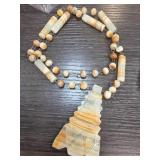 Beaded Necklace with Carved Stone Pendant