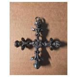 Metallic Cross Pendant Linked to Dallas Museum