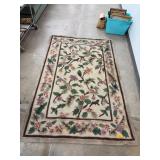 Two Handmade Rugs with Floral and Leopard Patterns