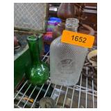 Two Decorative Glass Bottles With Textured Details