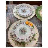 Four Floral Porcelain Plates