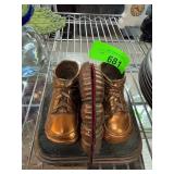 Metallic Shoe Bookends on a Base