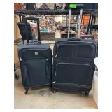 Two Black Rolling Suitcases