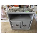 Gray Wooden Cabinet With Mosaic Tile Top