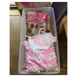 Plastic Tote With Assorted Fabrics and Linens