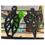 Two Black Cast Iron Trivets