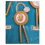 Decorative Gold-Toned Rope and Medallion Item
