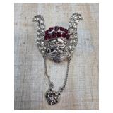 Silver-Tone Metal Face Brooch With Chain Pendant