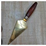 Gold-Colored Trowel With Wooden Handle