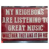 Red Metal Sign About Music and Neighbors