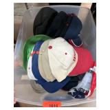 Baseball Caps in Plastic Bin