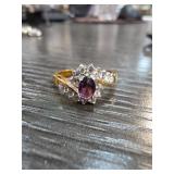 Gold-Tone Ring with Purple Gemstone and Clear Acce
