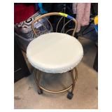 Bronze-Toned Metal Stool with Wheels and Cushion