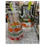 Two Glass Carafes with Fruit Motifs