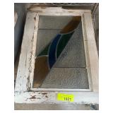 White-Framed Stained Glass Panel in Rustic Conditi