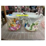 Four Porcelain Floral Creamers