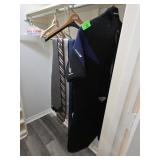 Closet Contents With Assorted Hangers and Hum