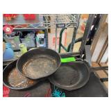Two Cast Iron Skillets with a Black Knight Sk