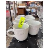 7 White Embossed Ceramic Mugs