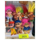 Nine Small Troll Dolls