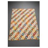 Patchwork Quilt with Interlocking Ring Motifs