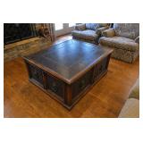 Ornate wooden coffee table with multiple drawers